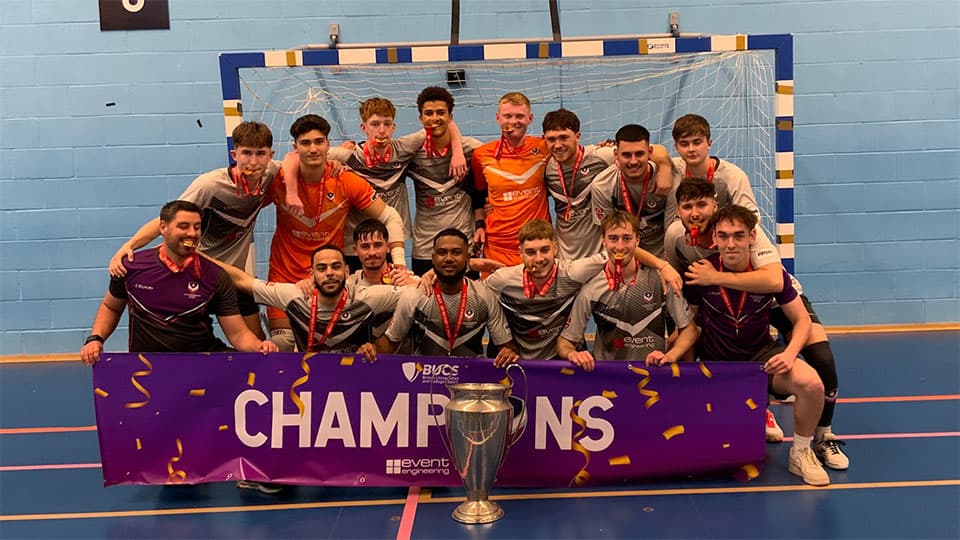 Loughborough University Futsal team lifting the championship trophy