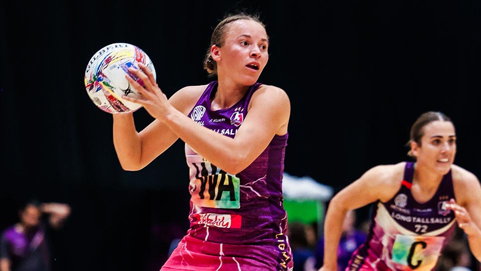 A Loughborough Lightning netball player catching the ball