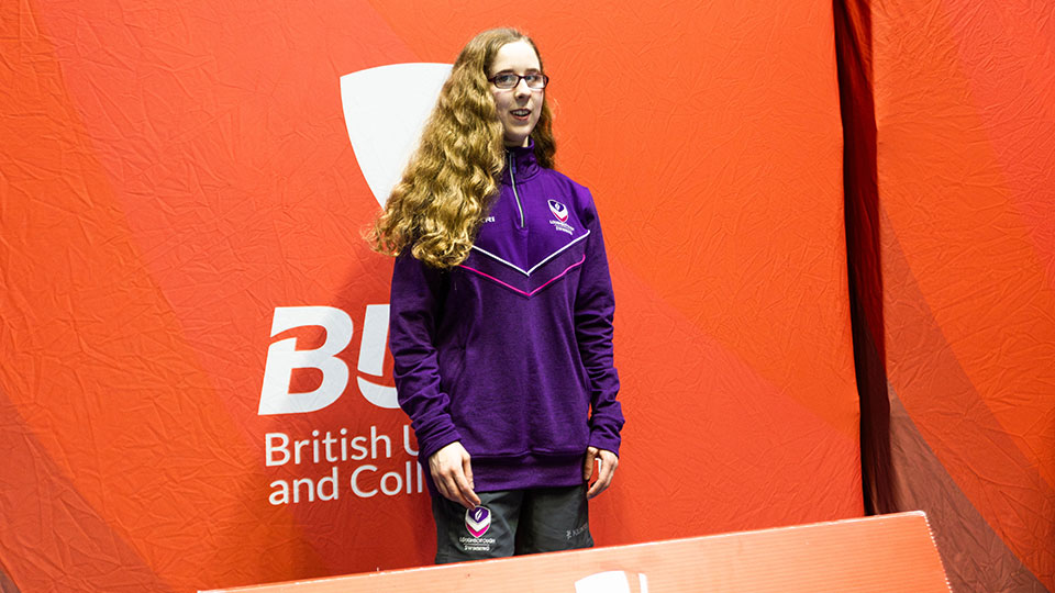 A para swimmer in a wheelchair next to the pool