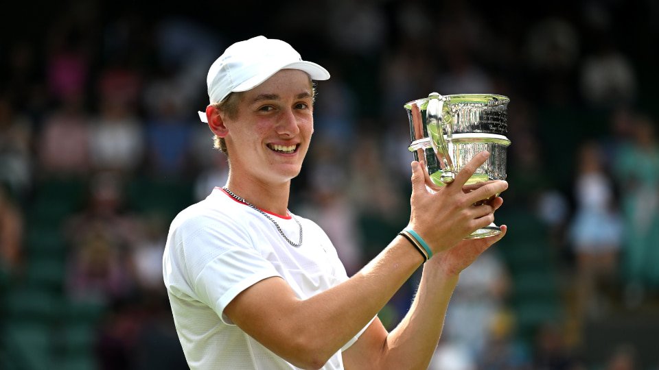 Henry Searle holding a trophy