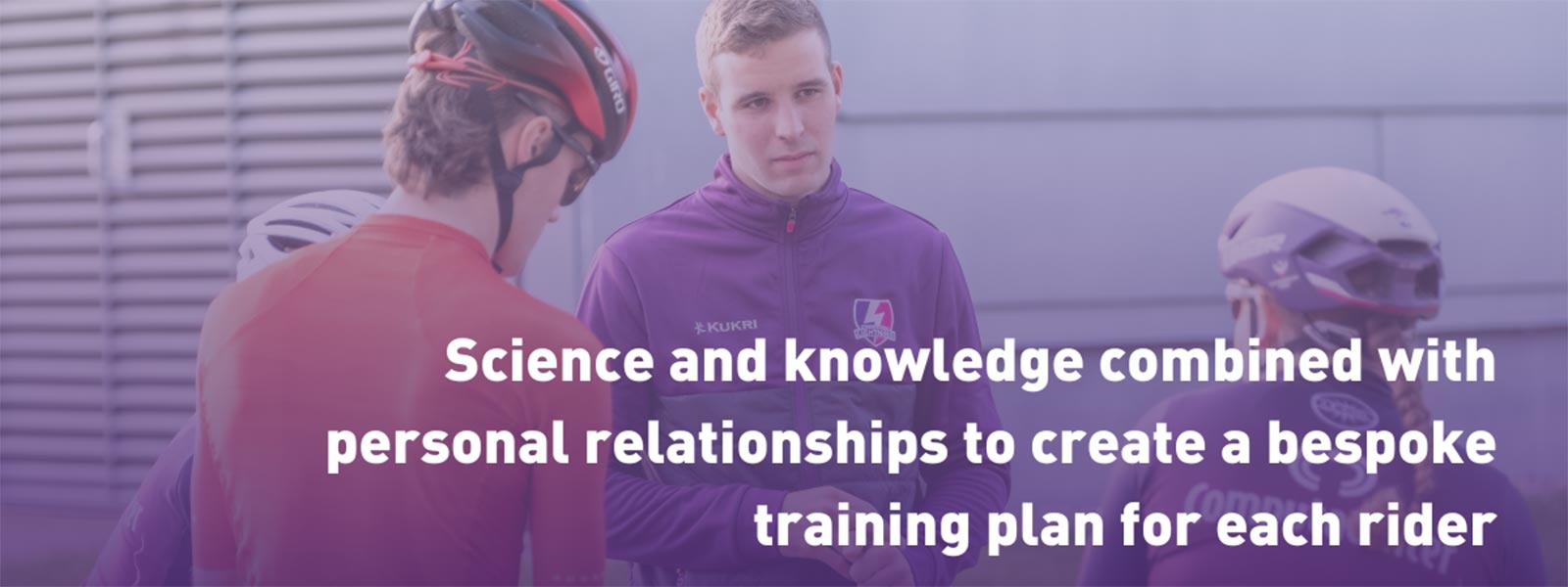 Max Holgate, our Cycling Coach, is talking to some riders out on a road.