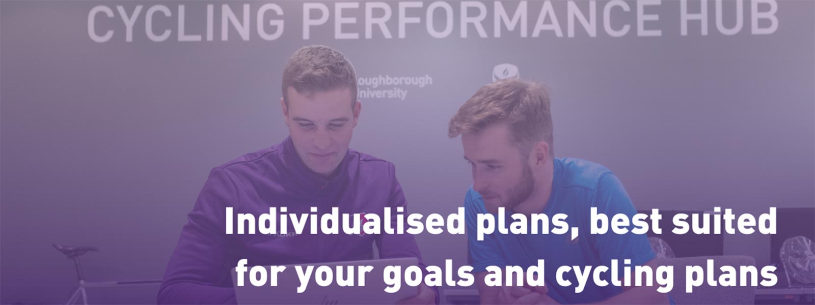 Max Holgate is going through a plan with a cyclist.