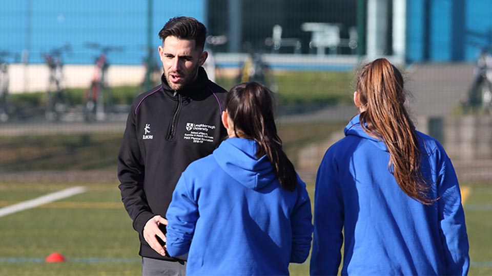 Coach talking to athletes