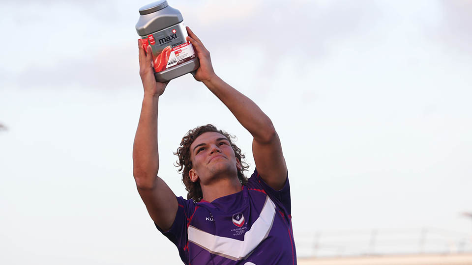 a man holding a grey container