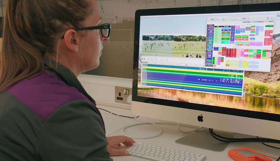 a woman looking at a computer screen