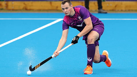 a hockey player passing the ball