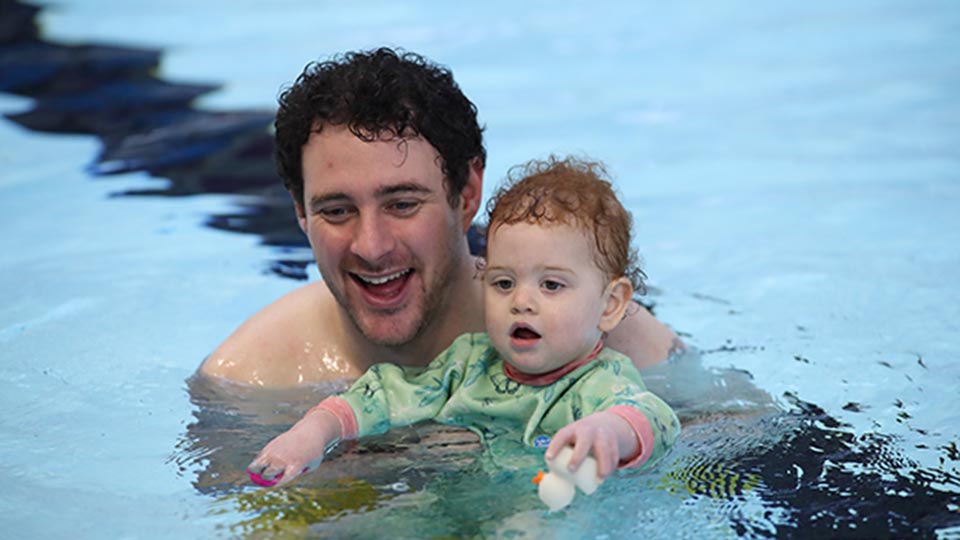 Adult and child in the swimming pool