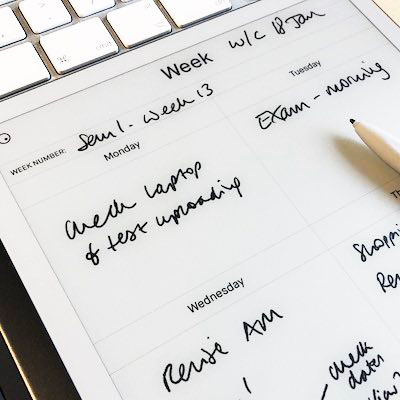 A tablet computer open, with a stylus lying on it with someone’s revision diary visible showing a weeks’ worth of events and things to do.