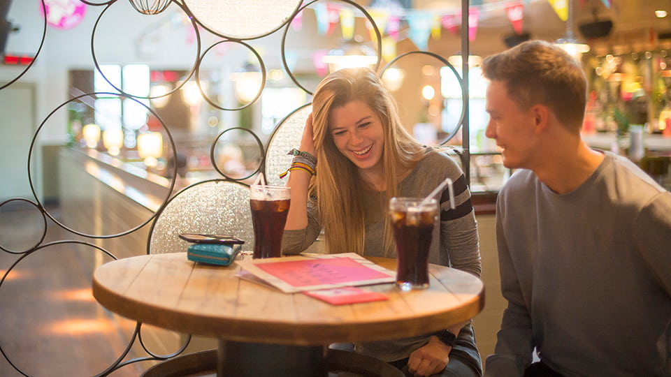 Two students sat having coffee.