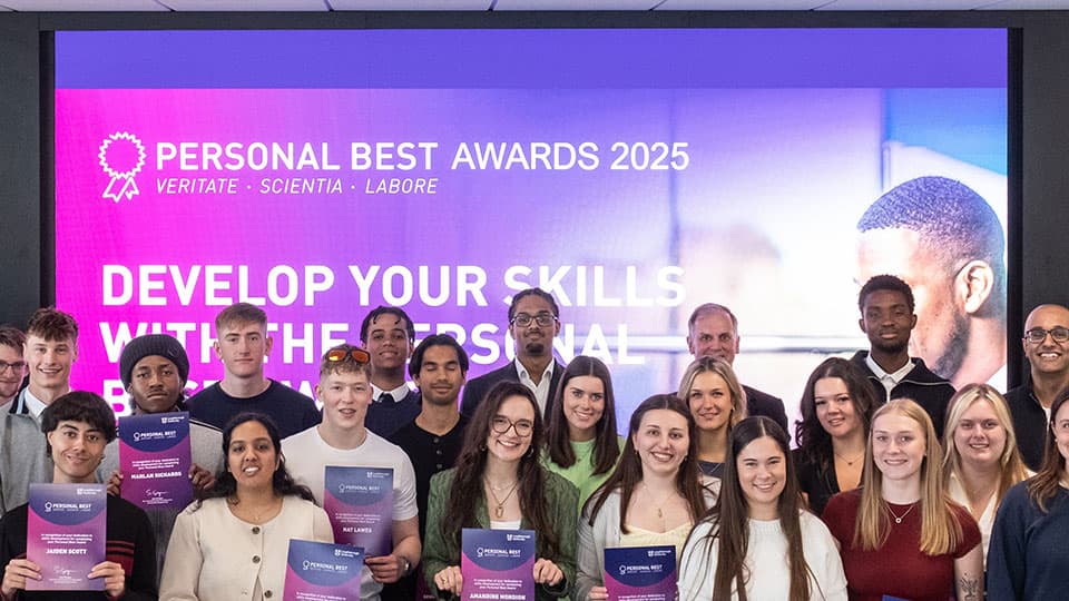 a group of prize winners standing for a photo