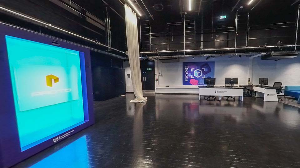 The DigiLabs East facility with a large 3D screen computer desks and lighting gantry