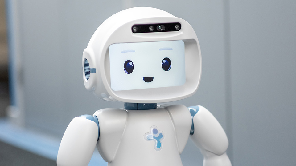 A QT Robot with a smiley face