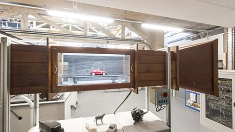 A model car in a smoke tunnel, analysing aerodynamics
