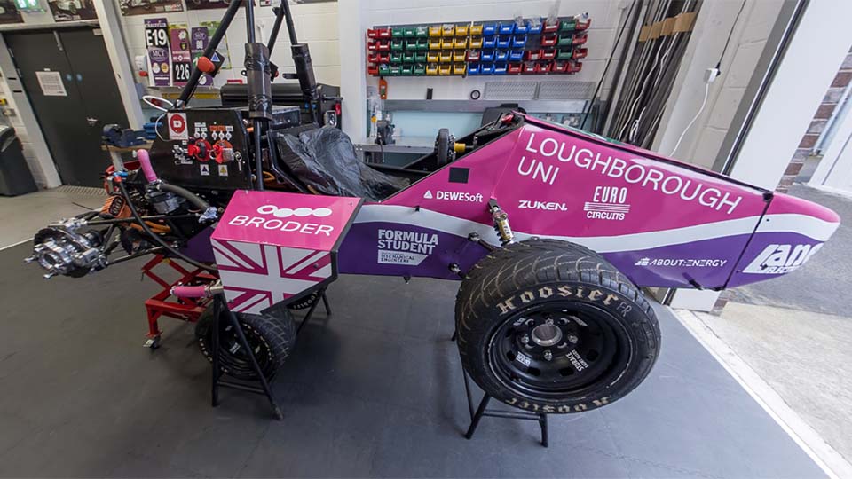 The Formula Student garage with racing car on wheel jacks