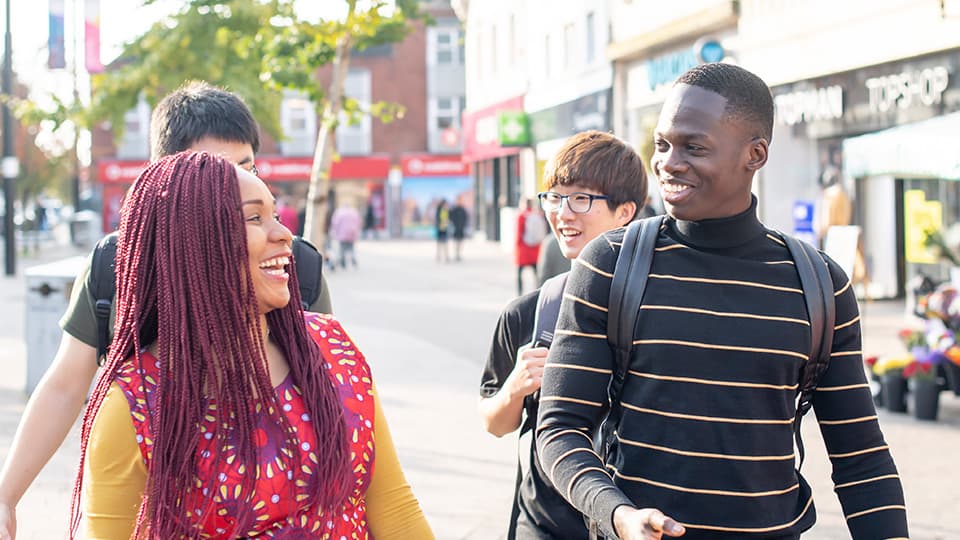 Students walking through town centre.