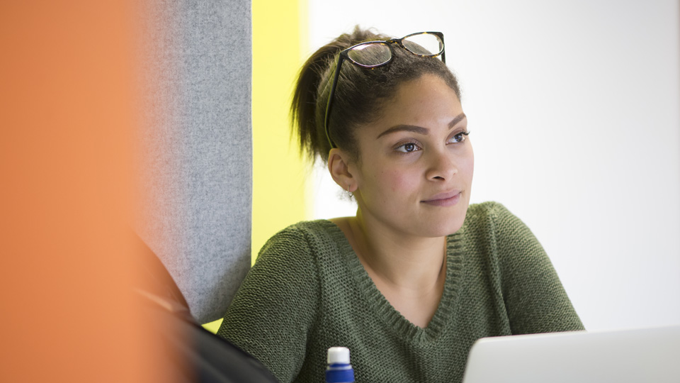 a student sitting at a computer