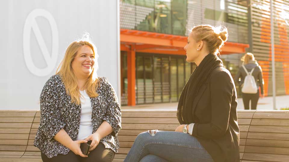 two students outside the London campus