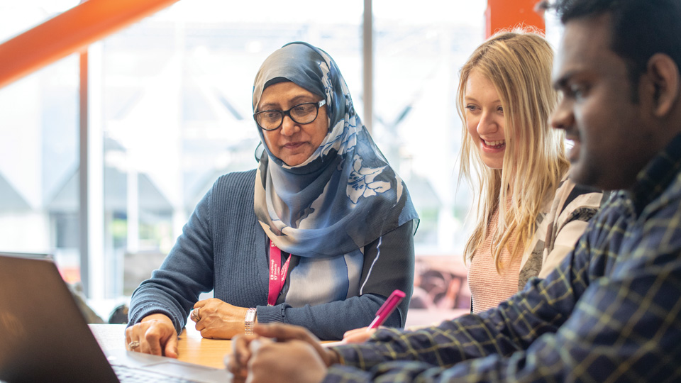 three students having a discussion