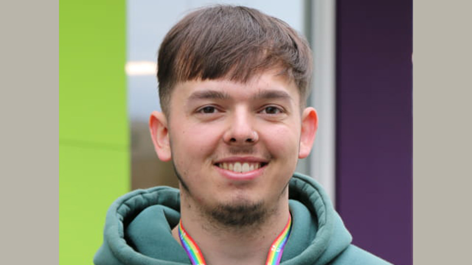 Tutor smiling to camera