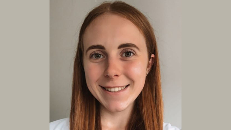 Teacher smiling to camera