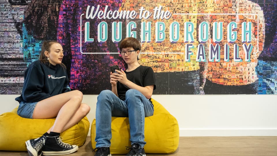 Two students sat on bean bags in the Students Union