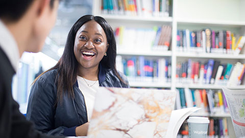 A student talking to another student at Loughborough University London