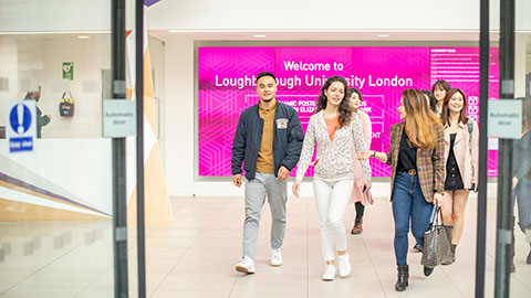 A group of students walking out of the foyer at Loughborough University London