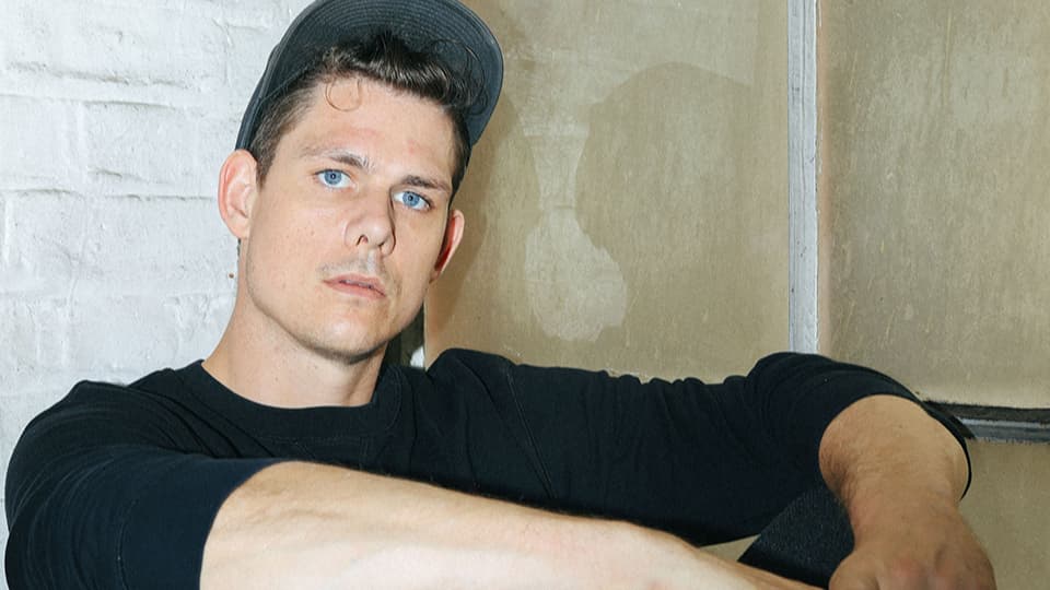 Ahren sat against a brick wall