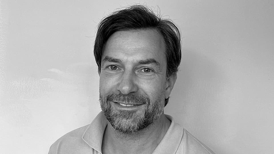 A black and white profile picture of Richard