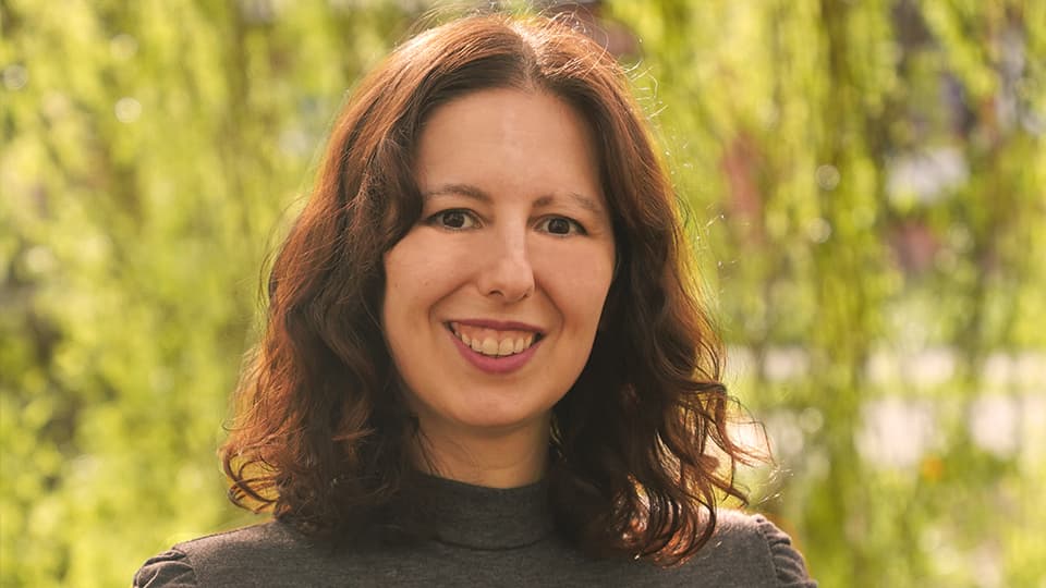 Stefania stood by some trees