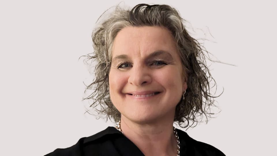 A female student smiling at the camera