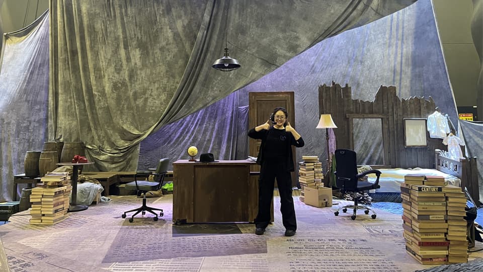 A female student working as a stage manager