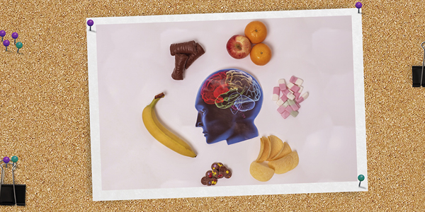 photo of an illustration of a head surrounded by food clipped to a notice board