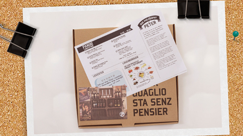 A pizza box and menu