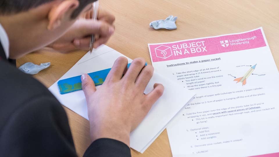 student completing a subject in a box activity