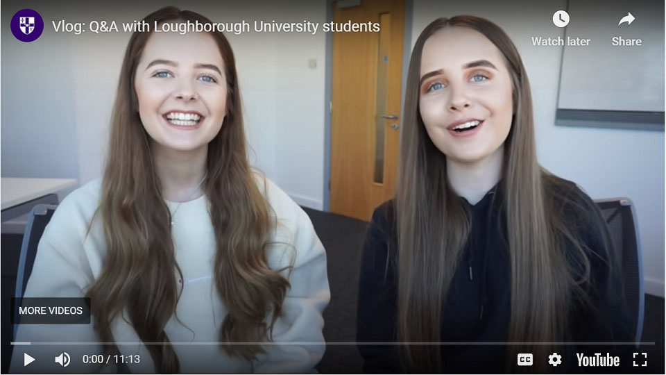 Screenshot from Holly and Amy's vlog which shows them both sitting in a room talking to the camera. 