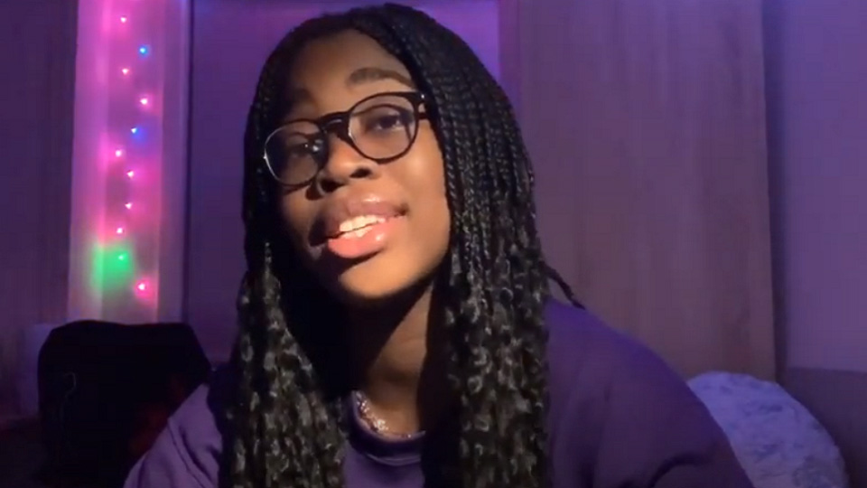 Screenshot from Jemima's vlog of her talking in front of the camera. 