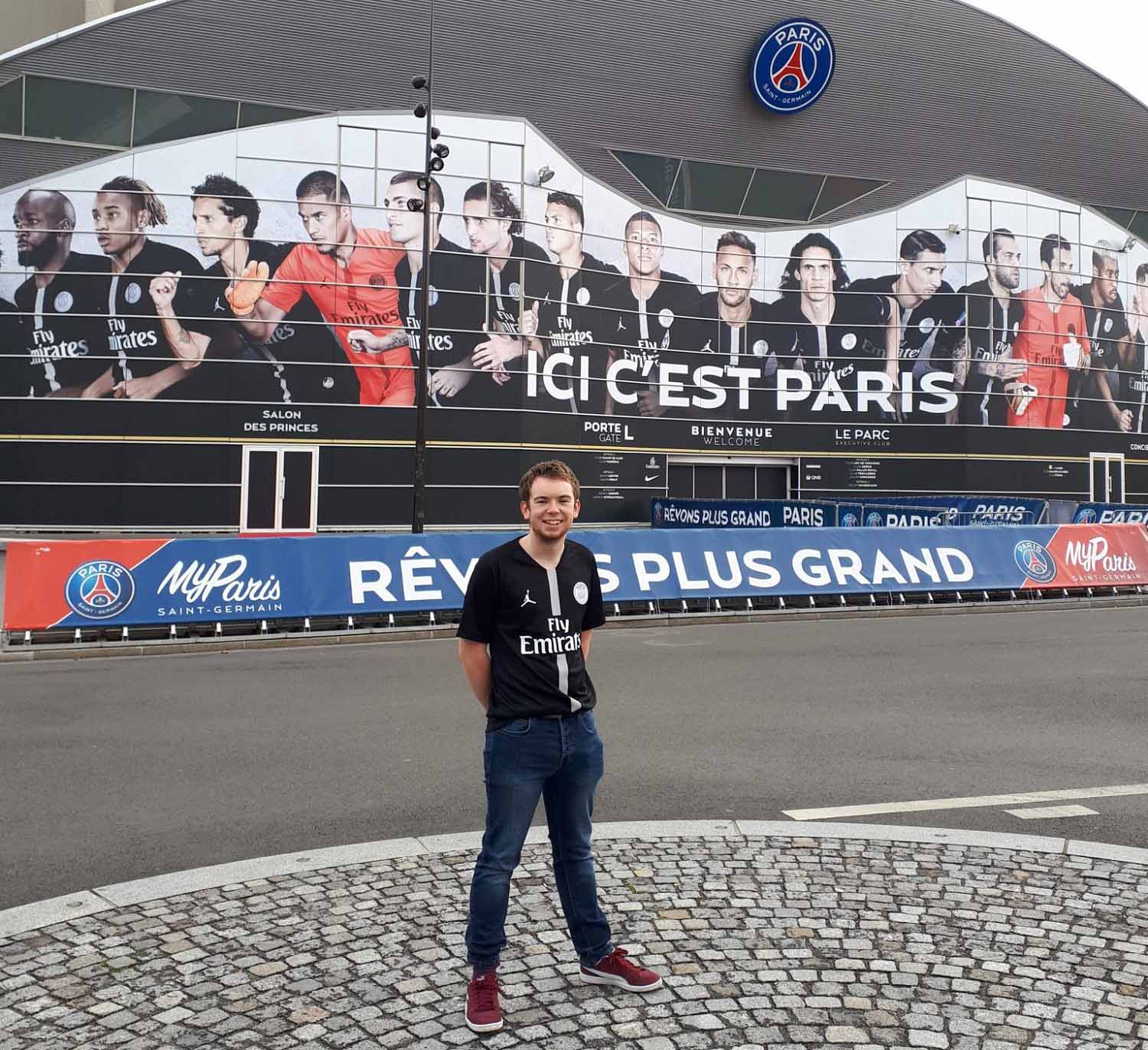 Joe in front of the Paris Saint-German FC stadium.