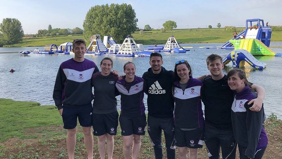 Hannah and some of her friends in front of an inflatable water course. 