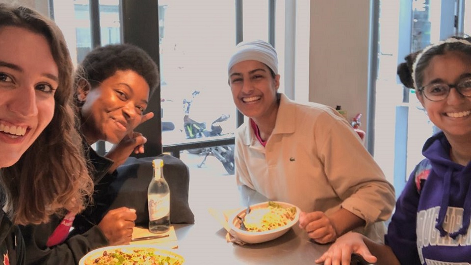Gugundeep and three friends at a restaurant. 