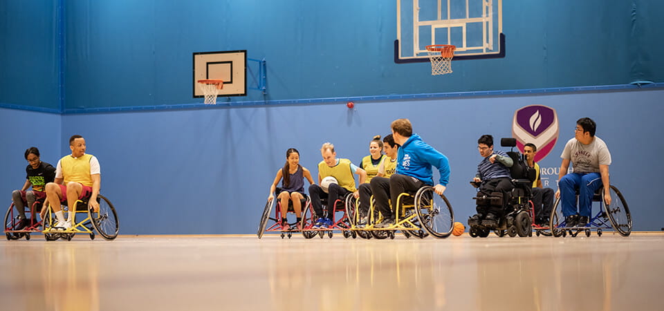 A game of wheelchair basketball in progress.