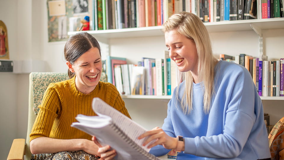 two female students laughing