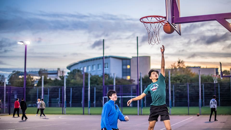 students playing basketball
