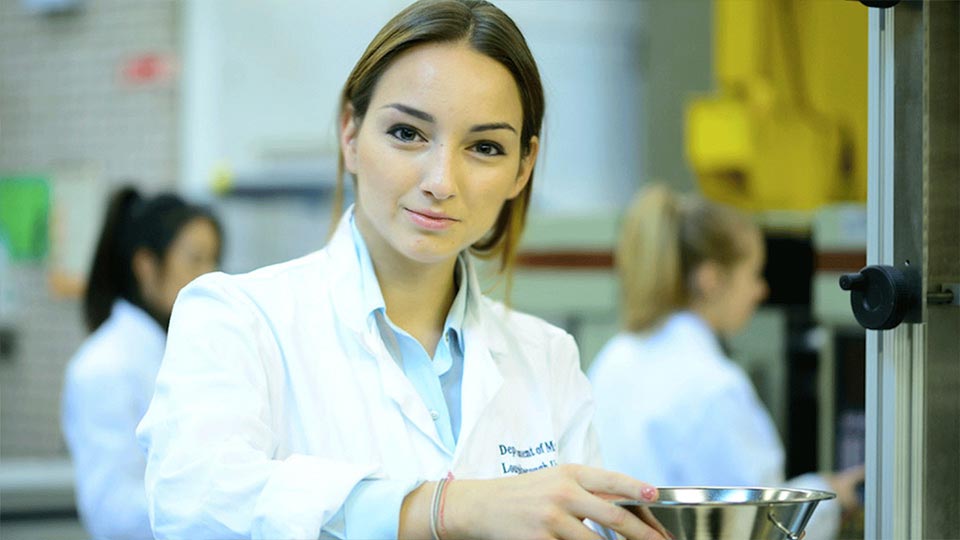 Anastasia working in a lab.