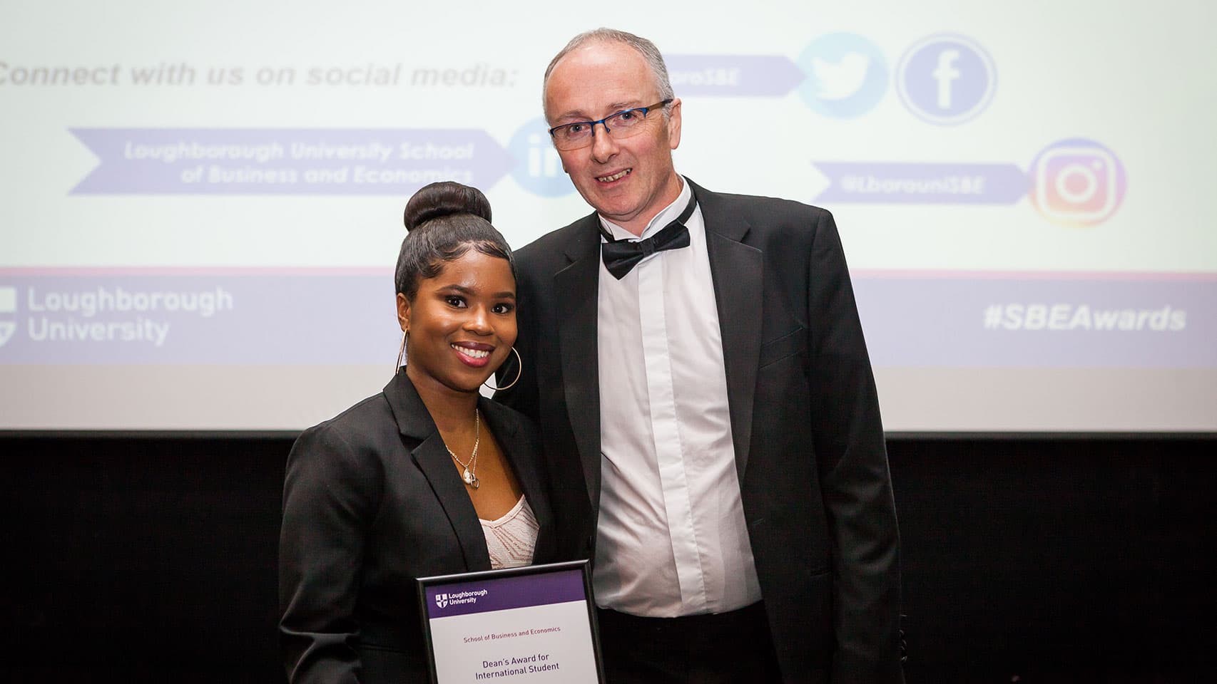 Student receiving award from Dean