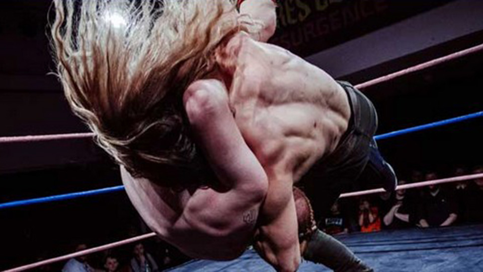 Two male wrestlers in a wrestling ring