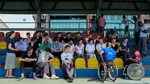 people sitting at a sports stadium