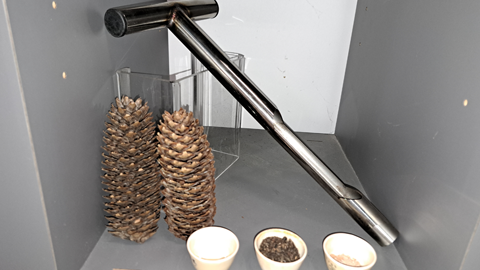 Pine cone, soil auger and furnace crucibles