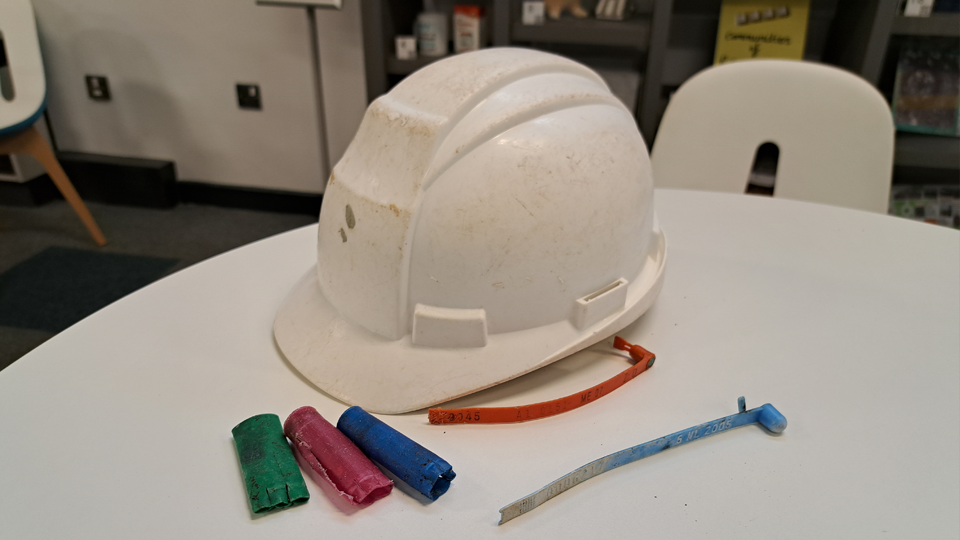 Hard hat, shotgun cartridges and lobster tags