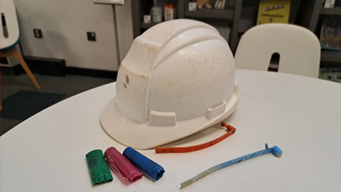 Hard hat, shotgun cartridges and lobster tags